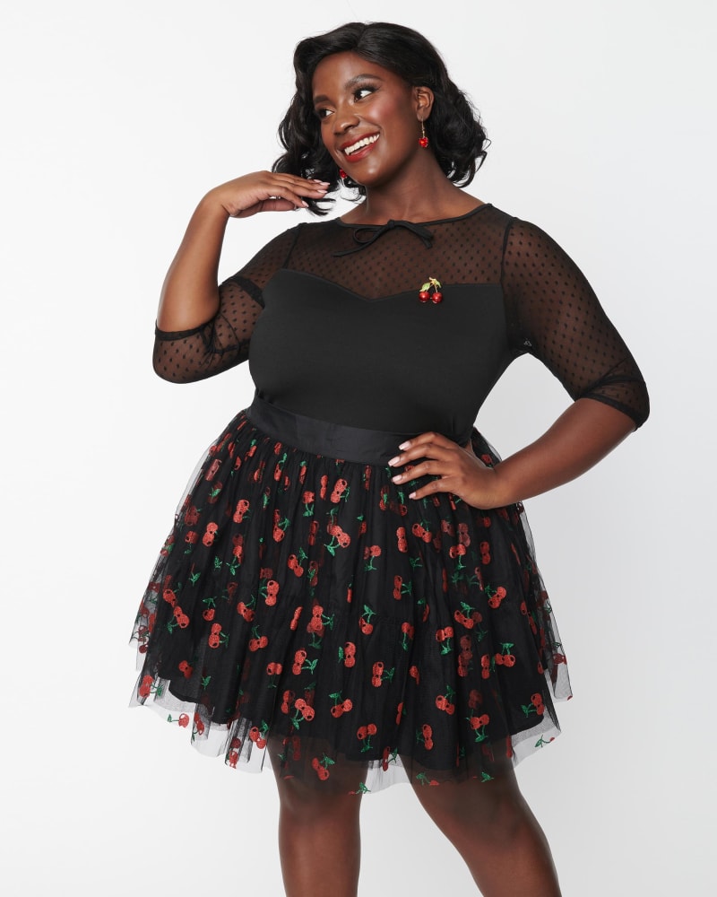 Front of a model wearing a size 1X/16 Unique Vintage Plus Size Black & Red Cherry Sweetie Pie Flare Skirt in Black & Red Cherry by Unique Vintage. | dia_product_style_image_id:269729